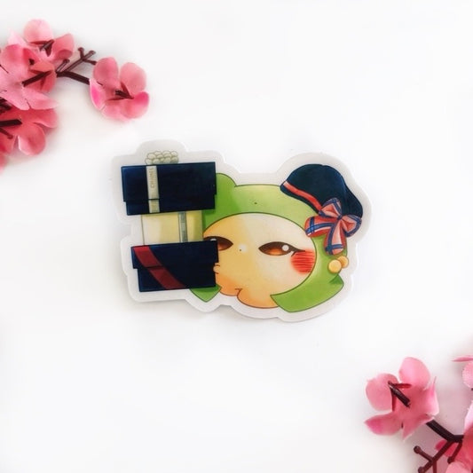 Cartoon character that is a chick with a frog costumer wearing a black beret with a pink and navy-blue bow, holding a Chanel gift box, a Dior gift box, and a Ralph-Lauren gift box on a white background with pink flowers.